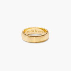 This Blakely is a refined statement piece you'll always love. It's luxurious and features a very fine ribbed texture that's sure to turn heads. Add some sophisticated flair and make a statement with this eye-catching ring! Available in 14k gold plated brass Band Width: 6mm Protected with an anti-tarnish barrier SKU: BYR1120 Braided Ring Band, Engraved Signet Ring, Tennis Jewelry, Modern Jewellery Design, Braided Ring, Brass Band, Textured Ring, Ribbed Texture, Ring Band