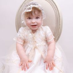 Handmade in the USA The Kristina is an elegant full-length heirloom Christening Gown. Designed with rich 100% antique white single layer silk dupioni, refined champagne floral embroidered lace and delicate handmade chiffon rose with green chiffon leaf. Includes matching lace bonnet to complete her gorgeous look. This designer inspired gown will please the most discerning little angel on her special day. 100% dupioni silk in antique white Floral embroidered champagne lace Handmade chiffon rose & Lace Bonnet, Silk Dupioni, Christening Gown, Dupioni Silk, Little Angel, Christening Gowns, Antique White, Embroidered Lace, Baby Wearing