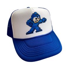 Mega Man Hat Snapback Cap | Vintage Style Video Game Megaman Trucker Hat | A Vintage Style Trucker Hat Cap Color - Blue Size - One Size Hits Most Adult Unisex Adjustable Snapback / Adjustable Bill Pure White Foam Front / High Quality Polyester Soft Mesh Back / Button on Top Most Orders Ship within 24 Hours! Retro Video, Funny Hats, Retro Videos, Man Hat, Retro Video Games, Hats Snapback, Mega Man, Cute Hats, Snapback Cap