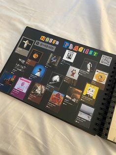 an open spiral notebook with pictures on it and a notepad attached to the cover