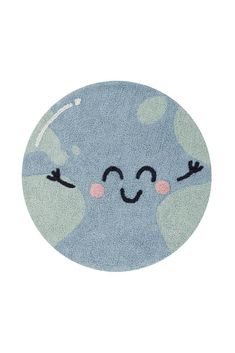 a round rug with an image of a blue planet on the front, and two eyes drawn