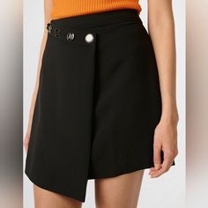 This Beautiful Skirt By Karl Lagerfeld Features A Concealed Side Zip Closure, Asymmetrical Hem, And Button Details. This Lightweight And Fitted Silhouette Is Lined For Comfort. Made From A Polyester/Spandex Blend, It’s Easy To Care For With Machine Wash In Cold Water And Line Dry, And It Is Imported. Black Asymmetrical Hem Mini Skirt For Work, Chic Asymmetrical Black Skort, Chic Black Asymmetrical Skort, Spring Workwear Skort With Asymmetrical Hem, Chic Asymmetrical Skort For Workwear, Chic Asymmetrical Hem Mini Skirt For Work, Asymmetrical Hem Skort For Spring Workwear, Chic Skort With Asymmetrical Hem For Party, Chic Short Wrap Skirt For Work