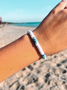 Sunkissed Sandbanks  ✨ This Beach Surfer Style bracelet is perfect for all your summer endeavours. It is handmade of polymer clays beads which are known to be quite durable. ✨ SIZING: Each bracelet measures around 6.5 inches which fits great for most teens and adults. However please contact me if you would like a custom length!  💌 FREE SHIPPING! - Through Canada Post Oversized Lettermail Feel free to message me with any questions, I will typically respond within 24 hours. I'm a teen who makes a Trendy Heishi Beads Friendship Bracelets For Beach, Summer Heishi Beads Friendship Bracelets, Trendy Heishi Beads Bracelets For Beach, Trendy Heishi Beaded Bracelets For Beach, Summer Friendship Heishi Beads Bracelets, Trendy Beach Bracelets With Tiny Beads, White Strand Bracelets For Vacation, White Strand Bracelet For Vacation, Tiny Beads Bracelets For Summer Beach