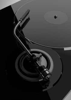 a black and white photo of a turntable