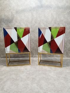 pair of modern art deco side tables with colorful geometric design