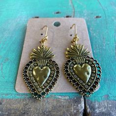 Antique/Vintage inspired Gold Pewter Sacred Heart Earrings with gold stainless steel lever backs. Vintage Metal Heart Earrings For Valentine's Day, Vintage Metal Heart Earrings, Vintage Heart Charm Drop Earrings, Handmade Vintage Metal Heart Earrings, Vintage Nickel-free Earrings For Valentine's Day, Nickel Free Vintage Earrings For Valentine's Day, Vintage Metal Heart Drop Earrings, Vintage Metal Heart Earrings For Gift, Vintage Metal Heart Earrings As A Gift