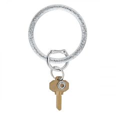 a keychain with a metal ring and two keys hanging from it's side