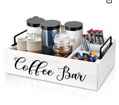 the coffee bar tray is filled with various items