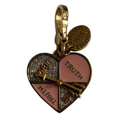 Juicy Couture Limited Edition Love Dial Charm Charm Name: Ltd Ed Love Dial Charm Sku: Yjru3630 Year Released: 2010 Description:Heart-Shaped Dial With 2 Pink Enamel “Truth” Quadrants, 2 Pave “Dare” Quadrants, And Spinning Gold Arrow. Gold 2010 Limited Edition Hangtag. Details: Due To The Vintage Nature Of This Item It May Contain Discoloration, Tarnish And Or Pitting. Items May Be Pre-Loved / Worn And May Show Signs Of Wear. Any Major Flaws Will Be Noted In The Product Description And Shown In The Images. Style Tags: Collectable, Charm Bracelet, Crown Logo, Discontinued, Gold Tone, Hard To Find, Htf, Juicy Couture, Nostalgic, Pave Crystals, Rare, Retired, Retro, Very Hard To F Gold Arrow, Crown Logo, Vintage Nature, Pink Enamel, Womens Jewelry Bracelets, Juicy Couture, Birthday Gift, Gold Tones, Limited Edition