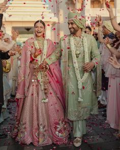 the newly married couple are showered with confetti