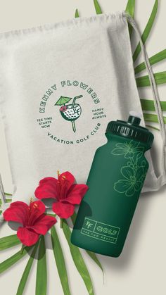 a green bottle and some red flowers next to a white drawstring bag with the words, culinary florisies on it