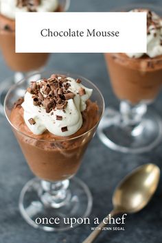 three desserts with chocolate and whipped cream in small glass dishes next to spoons