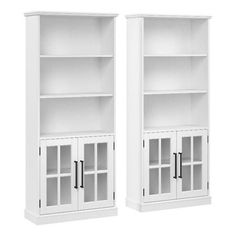 two white bookcases with glass doors on each side