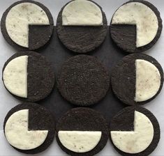 chocolate cookies with cream filling arranged in the shape of an arrow