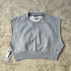 Aritzia Tna Cozy Perfect Crop Sweatshirt. New With Tags, Never Worn! The Color Is Heather Chrome. Would Be So Cute With Sweat Shorts. Sweatshirt Material With Cutoff Sleeves Like A Muscle Tee Kind Of. Cozy Cotton Everyday Tops, Cozy Everyday Cotton Tops, Athleisure Cotton Tops With Cozy Fit, Cotton Cozy Fit Tops For Athleisure, Comfy Cotton Everyday Tops, Sporty Cotton Tops With Cozy Fit, Cozy Cotton Tops For Everyday, Comfy Cotton Tops For Everyday, Cozy Cotton Athleisure Top