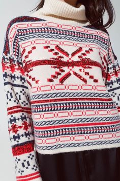 Celebrate the holiday season in style with our Cream Christmas Sweater. Embellished with a charming Christmas-themed print in red and blue, this sweater is adorned with sparkling sequin details, making it the perfect pick for your festive gatherings. Festive Design: The sweater showcases a delightful Christmas style print, enhanced with eye-catching sequin details for a touch of holiday sparkle. Cozy Turtle Neck: Stay warm and stylish with the chunky turtle neck design, perfect for those chilly Festive Holiday Sweater With Crew Neck, Red Festive Winter Sweater, Festive Holiday Crew Neck Sweater, Red Knit Christmas Top, Christmas Sequin Top For Festive Occasions, Red Knit Top For Christmas, Red Sequined Top For Christmas, Festive Christmas Fair Isle Sweater, Festive Fair Isle Christmas Sweater