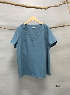 "Nothing beats linen in hot sunny days. Simple yet classic, this V neck line tee with seam details in the neckline is just comfort and chic. -100% linen -Straight silhouette -V neck with seam details -Short sleeve -Side slits Please provide your shoulder width, full bust measurement ( measured around the fullest part) and your height along with your order in the note to seller box. Don't see your size? Please message us for custom made order. Fitting: This style fits true to size. If you prefer Solid Color Linen T-shirt For Spring, Linen T-shirt For Summer, Solid Linen T-shirt For Summer, Summer Linen T-shirt, Spring V-neck Flax Top, Flax Linen V-neck Top, Flax V-neck Top For Spring, Linen Relaxed Fit Short Sleeve T-shirt, Relaxed Fit Linen T-shirt Short Sleeve