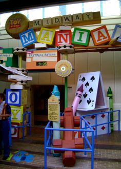 the entrance to an indoor play area with lots of colorful signs and letters on it