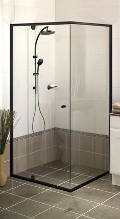 a walk in shower sitting inside of a bathroom