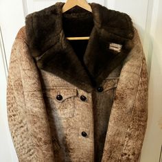 Fur Fashion Sheepskin Fur Coat. Color: Tan/Beige And Brown. Company Is Based Out Of Milwaukee, Wi, Although They Appear To No Longer Be In Business (I Couldn't Find Any Information About Them Online). The Coat Is Designed Such That The Skin/Leather Is On The Outside Of The Coat And The Fur Is On The Inside. Coat Is In Excellent Condition, Seldom If Ever Worn (It Has Been Sitting In My Dad's Closet For Many Years). The Skin/Leather Has A Few Naturally Occurring Blemishes/Imperfections, Which I Tr Fitted Brown Sheepskin Outerwear, Fitted Brown Sheepskin Fur Coat, Fitted Brown Shearling Fur Coat, Designer Brown Shearling Outerwear, Designer Brown Outerwear With Faux Fur Lining, Designer Brown Sheepskin Outerwear, Sheepskin Throw, Mens Fur, Vintage Fur