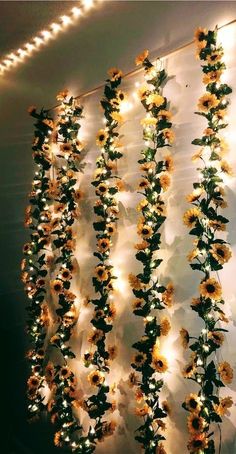 sunflower string lights are hanging from the ceiling