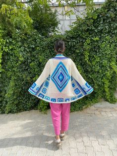 in stock! Granny square blue and white boho style patchwork cardigan vest is combined with sky and summer inspiration. :) The yarn used in the cardigan is cotton. It will be a unique gift to have a wonderful product for your loved ones for their birthdays and special occasions! Be the sparkle of your festivals and parties! Cardigan Sizes Width 110 cm / 43.3 inch Height 80 cm / 31.5 inches Model Size: 178 cm / 5 Feet 10.79 Inches / 63 kg - 138 lb. washing information It can be washed in the hand White Bohemian Handmade Outerwear, Bohemian Patchwork Cardigan For Summer, Bohemian White Outerwear With Granny Square Details, Bohemian White Outerwear With Granny Square, White Bohemian Handmade Cardigan, White Bohemian Cardigan For Festivals, Blue Granny Square Cardigan For Fall, Bohemian Blue Cardigan For Winter, Blue Bohemian Cardigan For Winter