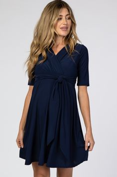 A comfortable & casual maternity dress perfect for any day!  A solid maternity nursing dress featuring a self-tie waist, short sleeves and a wrap v-neckline. The Navy Waist Tie Maternity Nursing Dress is perfectly bump-friendly! Solid Color Short Sleeve Maternity Dress For Summer, Solid Color Short Sleeve Maternity Summer Dress, Bump Friendly Maternity Dress With Short Sleeves, Bump Friendly Short Sleeve Maternity Dress, Bump-friendly Short Sleeve Maternity Dress, Solid Color Short Sleeve Maternity Dresses, Bump Friendly V-neck Maternity Dress, Maternity V-neck Bump Friendly Dress, Solid V-neck Maternity Dress