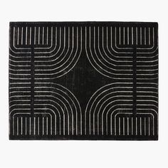 a black and white rug with lines in the middle on a white background, it looks like an art deco design