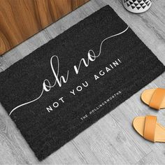 a door mat that says, oh no not you again with sandals on the floor