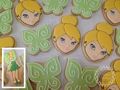 some decorated cookies with tinkerbells and green leaves on them are shown next to a photo of tinkerbells