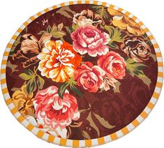 a round rug with colorful flowers on it