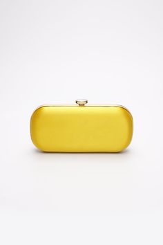 The Limoncello Yellow Bella Clutch is a bold yellow bridal handbag, crafted with duchess satin by Italian artisans featuring a lively pop of color. Planning a maximalist wedding day or looking to make a powerful statement at your next gala? Inspired by Italy’s Amalfi Coast, a coastline featuring terraced vineyards and cliffside lemon groves, this luxury handbag will make a statement on your wedding day, at a red-carpet affair, or on a tropical destination trip. First seen on celebrity stylist Mi Yellow Clutch Bag, Luxury Clutch Purse, Maximalist Wedding, Bridal Handbag, Cc Jewelry, Yellow Bags, Colorful Clutch, Red Carpet Affair, Yellow Clutch