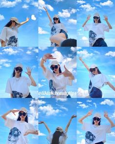 the woman is posing for pictures with her hands in the air and clouds behind her