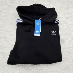 Women's Adidas Short Hoodie Black Size Medium. Sold As Pictured. Price Is Firm. Thank You Fleece Hoodie With Three Stripes For Streetwear, Casual Fleece Hoodie With Three Stripes, Black Hoodie With Three Stripes For Streetwear, Black Three Stripes Hoodie For Streetwear, Adidas Black Hoodie With Ribbed Cuffs, Black Adidas Hoodie With Ribbed Cuffs, Sporty Black Hoodie With Three Stripes, Black Hooded Sweatshirt With Three Stripes, Winter Fleece Hoodie With Three Stripes