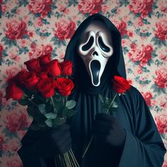 a person wearing a mask holding roses in their hands