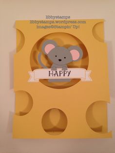 a card with a mouse on it and the words happy written in front of it