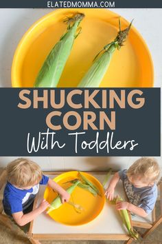 two children are sitting at a table with corn on the cob