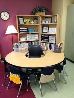 an image of a table with chairs and bookshelves in the background on instagram