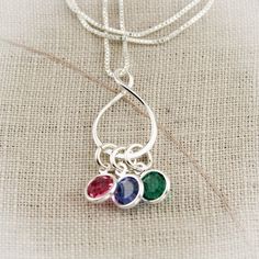 "Eternity Charm Necklace with Birthstones, Personalized Grandmother Necklace with Birthstones, Infinity Mother Necklace with Children This is a perfect necklace for a grandmother to keep her children and grandchildren close to her heart. A sterling silver eternity or infinity ring charm with birthstones to represent all of her loved ones. The infinity charm is approximately 3/4\" in diameter. --------------------------------------------------------------------------------------------- Please lis Sterling Silver Teardrop Birthday Necklaces, Sterling Silver Teardrop Necklace For Birthday, Sterling Silver Teardrop Necklace For Birthdays, Silver Oval Necklace For Birthday, Silver Oval Pendant Necklace For Birthday, Silver Infinity Necklaces With Birthstone, Silver Infinity Necklace With Birthstone, Grandmother Necklace, Mother Necklace