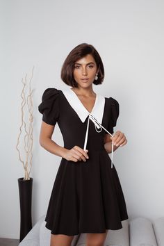 Fabric: Crepe Viscose 50%, Polyester 40%, Elastane 10% Collared neckline Puffed sleeves Short sleeve Tie detail Zipper lock at the back Mini length Zipper Lock, Puff Sleeve Dresses, Short Sleeve Mini Dress, Puffed Sleeves, Trendy Accessories, Mini Dress With Sleeves, Ruffle Hem, Mini Black Dress, Puff Sleeve