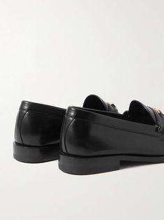 Shop CELINE HOMME Triomphe Logo-Embellished Polished-Leather Loafers, Explore the latest in-season CELINE HOMME collection today on MR PORTER Classic Formal Loafers With Studded Rubber Outsoles, Luxury Loafers With Studded Rubber Outsoles, Luxury Business Loafers With Studded Rubber Outsoles, Luxury Studded Loafers For Business, Luxury Tassel Loafers For Workwear, Mens Leather Loafers, Loafers For Men, Black Polish, Mr Porter