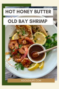 a white plate topped with shrimp and bread