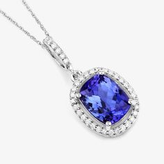 14K White Gold Tanzanite Pendant, Genuine Tanzanite and Diamond Gold Pendant Necklace, Statement Pendant, December Birthstone Pendant Stunning verdant color beautifies this fundamental symbol of beauty. A glorious halo pendant is adored with genuine cushion tanzanite gemstones totaling 2.37 carats. Set in polished 14k white gold with fine finish on a . A truly special piece for yourself or to gift for any festive milestone. , tanzanite pendant halo necklace. 14k gold tanzanite and diamond pendan Classic Tanzanite Multi-stone Jewelry, Wedding Tanzanite Pendant Necklace, Tanzanite Gemstone Pendant Necklace, Tanzanite Gemstone Necklace For Wedding, Tanzanite Gemstone Pendant Necklaces, Tanzanite Birthstone Necklaces For Anniversary, Classic Tanzanite Pendant Jewelry, Tanzanite Birthstone Pendant, Tanzanite Pendant For Anniversary