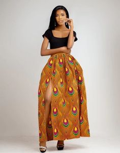 Say Hello! to our Achol maxi skirt, the African fusion skirt that will make you feel like you're living in a colourful world! With a high slit  and high waist 3 inch waist band, it's perfect for girls on the go. It's full of life and adventure and is always up for anything! Description - Pleated waistline - Side pockets  - High right slit - Back invisible zipper  - Half lined for added comfort  - 2.5 inches waist band - Floor length - Made in Cameroon - Fabric from Benin Care instructions - Hand Maxi Rock, African Skirt, African Skirts, Invisible Zipper, Waist Band, African Print, Floor Length, Maxi Skirt, Care Instructions