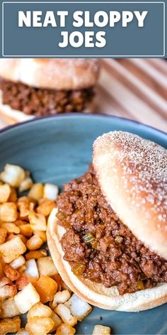 two sloppy joes are on a plate with potatoes