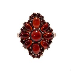 "Handcrafted in the 1990s, this exquisite pyrope garnet ring boasts an array of carbuncles, also known as garnet cabochons, elegantly complemented by round-cut garnets. The cluster arrangement forms a captivating floral motif, and when kissed by sunlight, the garnets emit a radiant, enchanting glow. This charming vintage ring, adorned with garnets and plated in rose gold vermeil, makes a delightful addition to your jewelry collection. Garnet jewelry has a rich history dating back thousands of ye Garnet Ring Gold, Pyrope Garnet, Demantoid Garnet, Garnet Gem, Antique Gold Jewelry, Antique Brooches, Garnet Jewelry, Cabochon Ring, Garnet Ring