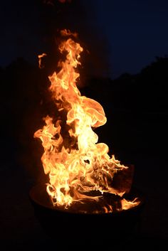 a fire pit with flames coming out of it