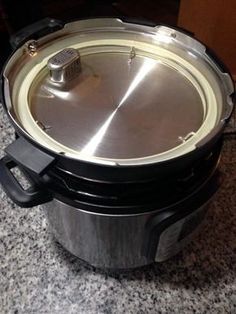 an electric pressure cooker sitting on top of a counter