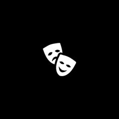 two white masks on a black background