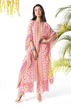 Pink crepe kaftan in geometric print. Paired with a printed palazzo.
Component: 2
Pattern: Printed
Type Of Work: Geometric print
Neckline: High neck
Sleeve Type: Three quarter
Fabric: Crepe
Color: Pink
Other Details: 
Front slit kaftan
Keyhole back
Note: Accessories worn by the model are not for sale
Occasion: Party, Resort - Aza Fashions Pink Kaftan, Kaftan Set, Printed Kaftan, Printed Palazzo Pants, Palazzo Set, Pants Fit, Indian Fashion Designers, Pernia Pop Up Shop, Palazzo Pants